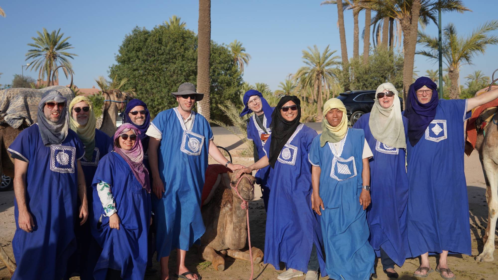 Participants taking a camel ride in Marrakech, Morocco